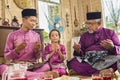 Muslim family saying prayers before meals