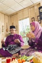 Muslim family saying prayers before meals Royalty Free Stock Photo