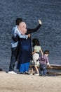 Muslim family is taking selfie at seaside