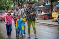 Muslim family walking in rain