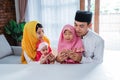 Muslim father,mother and daughter praying together Royalty Free Stock Photo