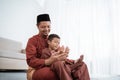 Muslim father and son praying together Royalty Free Stock Photo