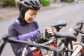 muslim female cyclist unloading her road bicycle on a rack in the back of her car Royalty Free Stock Photo