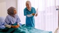 Muslim doctor analysing disease to patient at hospital room