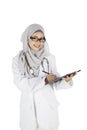 Muslim female doctor with clipboard