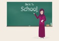 Muslim female teacher and Back to school text on chalkboard Royalty Free Stock Photo