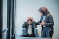 muslim female worker comforting her partner during hard time