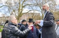 Muslim fundamentalist preacher holding a Koran. Speakers Corner, Hyde Park, London, England