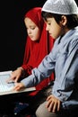 Muslim girl and boy on black background