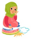 Muslim girl drawing rainbow in sky. Kid with color crayons