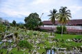 Muslim graveyard on sloping hill with Brooke Dockyard and crane Kuching Sarawak Malaysia