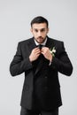 Muslim groom fixing tie and looking Royalty Free Stock Photo