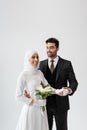 muslim groom holding hand of joyful Royalty Free Stock Photo