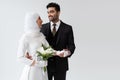 muslim groom holding hand of smiling Royalty Free Stock Photo