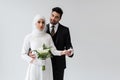 muslim groom holding hand of smiling Royalty Free Stock Photo