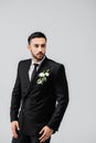 Muslim groom in suit and floral