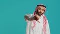 Muslim guy with ancient gown and kufiyah Royalty Free Stock Photo