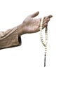 Muslim hand holding prayer beads