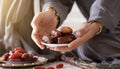 Muslim hands share a fistful of dates. ramadan kareem concept