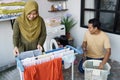 Happy muslim family doing laundry at home Royalty Free Stock Photo