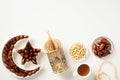 Muslim holiday Ramadan Kareem concept. Flat lay dried dates in Islamic star and crescent plate, nuts, oriental lantern, cup of tea Royalty Free Stock Photo