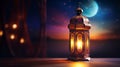 During the Muslim holy month of Ramadan Kareem, a decorative Arabic lantern with a burning candle provides a warm glow in the
