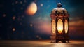 During the Muslim holy month of Ramadan Kareem, a decorative Arabic lantern with a burning candle provides a warm glow in the