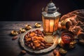 Muslim iftar breaking fast with dried dates, nuts and sweet drinks, with lantern lamp as decoration. Created with