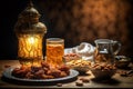 Muslim iftar breaking fast with dried dates, nuts and sweet drinks, with lantern lamp as decoration. Created with