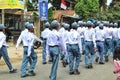 Muslim Indonesian students walking and marching on the street with uniforms in celebrating the country's Independence Day