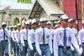 Muslim Indonesian students walking and marching on the street with uniforms in celebrating the country's Independence Day