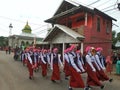 Muslim Indonesian students walking on the street with uniforms in celebrating the country's Independece Day