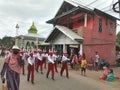 Muslim Indonesian students walking on the street with uniforms in celebrating the country's Independece Day