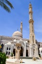 Muslim Islamic Mosque for the gathering of Muslims for general prayer, a liturgical architectural structure with high towers, dome Royalty Free Stock Photo