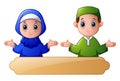 Muslim kid couple waving hand and celebrate ramadan with blank sign