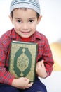 Muslim kid with holy Koran Royalty Free Stock Photo