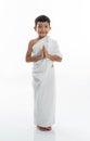 Muslim kid with ihram smiling to camera