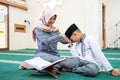 Muslim kid pay respect to his teache