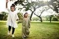 Muslim kids running in the park Royalty Free Stock Photo