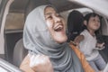 Muslim Lady Dancing Happily in Her Car