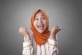 Muslim Lady Smiling with Winning Gesture