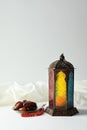 Muslim lamp, dates and misbaha on light background