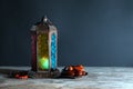 Muslim lamp, dates and misbaha on wooden table