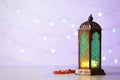 Muslim lamp Fanus with prayer beads and space for design