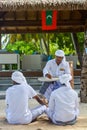Muslim maldivian senior dhivehi orthography teacher giving lesson to his students Royalty Free Stock Photo