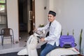 Muslim male travelling for eid mubarak lebaran by motorcyle