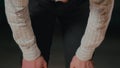 Muslim man bowing in prayer with hands placed on his knees