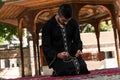 Muslim Man In Dishdasha Is Praying In The Mosque Royalty Free Stock Photo