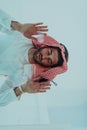 Muslim man doing sujud or sajdah on the glass floor Royalty Free Stock Photo