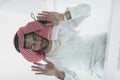 Muslim man doing sujud or sajdah on the glass floor Royalty Free Stock Photo